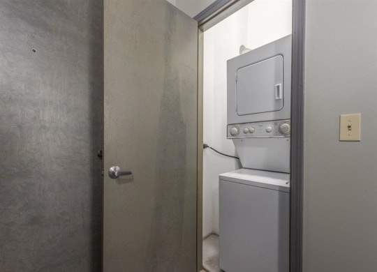 a small laundry room with a washer and dryer