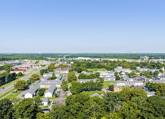 A bird's eye view of a residential area with houses and trees.