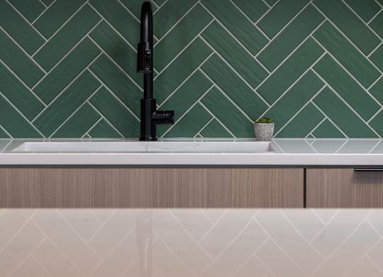 A black faucet is on a white sink at The Park Apartments, Ohio, 44113