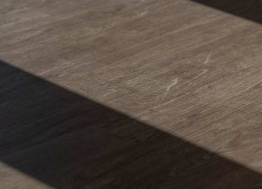 A close up of a wooden floor with a dark stripe running through it at The Park Apartments, Cleveland 44113