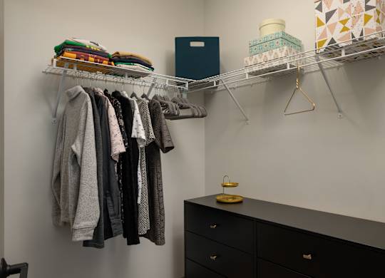 Clothes hanging on a rack in a room at The Park Apartments, Ohio, 44113