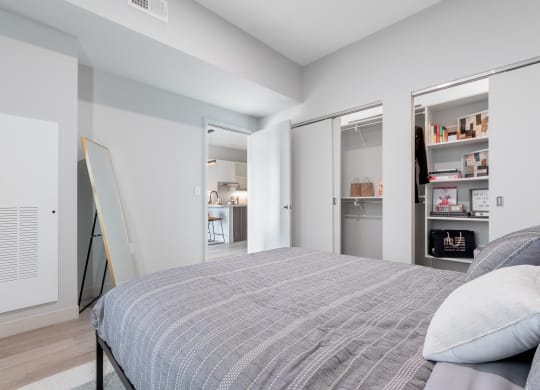 Bedroom with queen bed at TREO Apartments, Ohio
