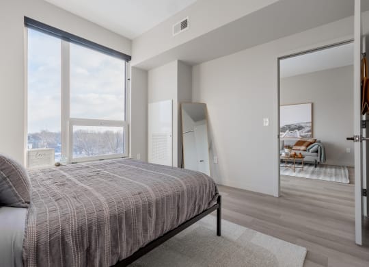 Queen bed with Cleveland city views at TREO Apartments, Cleveland