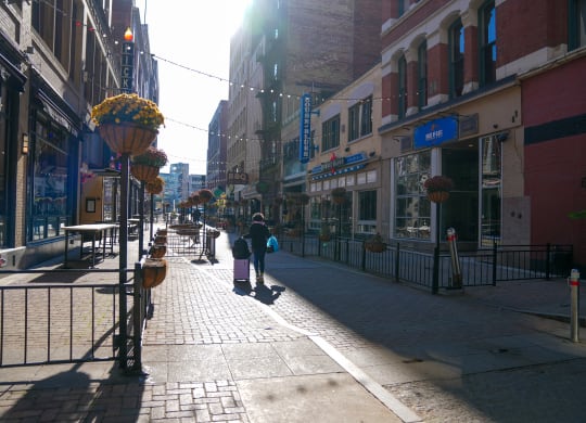 a city street with people walking down the sidewalk at East 4th Street, Cleveland, Ohio