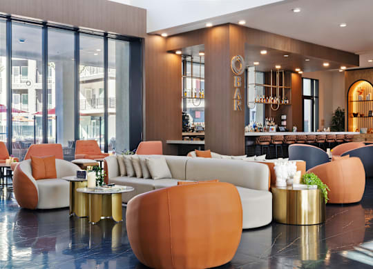 A modern living room with a large sofa and a coffee table.