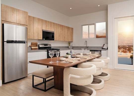 Apartment kitchen and dining area at Otonomus Las Vegas