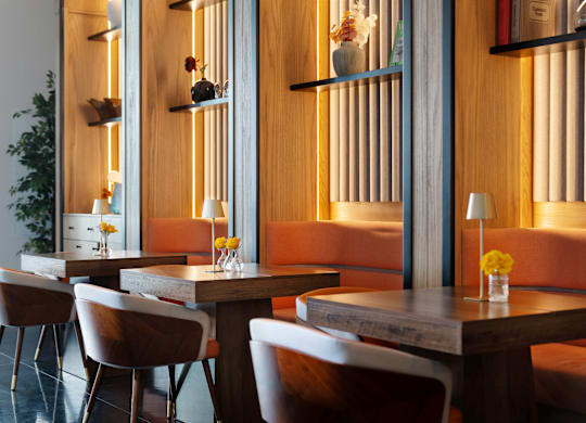 A modern dining room with wooden furniture and decorative shelves.