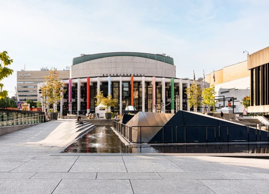a large building with a fountain in front of it