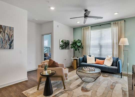 a spacious living room with a couch at Apex apartments in Colorado Springs, CO