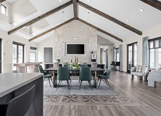 a large dining room with a large table and chairs