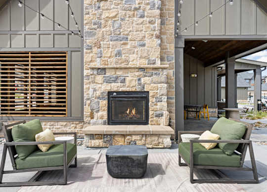 a living room with couches and a fireplace
