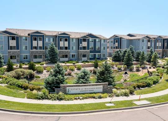 A large building complex named Estate at Woodman Ridge.