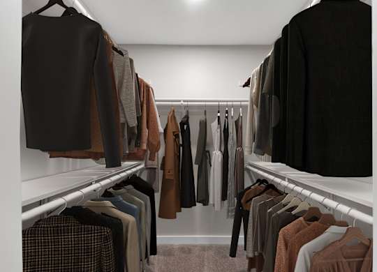 A row of clothes hanging on a rack.