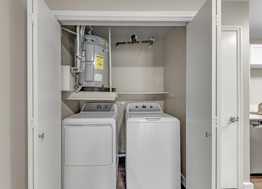 A laundry room with a washer and dryer.