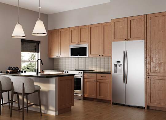 A kitchen with wooden cabinets and a white refrigerator.