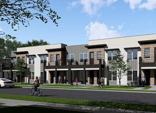 A modern building with a bicycle and people walking in front at  Aerie Heartwood Preserve in Omaha, NE