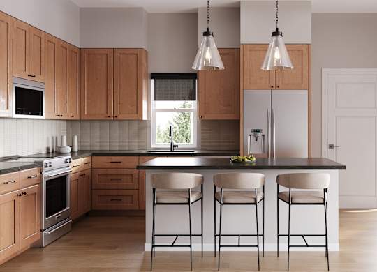 A kitchen with wooden cabinets and a black countertop.