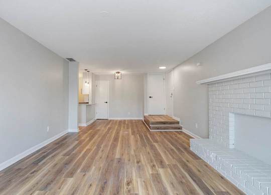 A room with wooden flooring and white walls. at The Onyx Hoover Apartments, Alabama, 35216