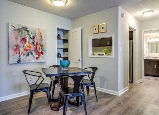 A dining room with a table and chairs at The Onyx Hoover Apartments, Hoover, AL, 35216