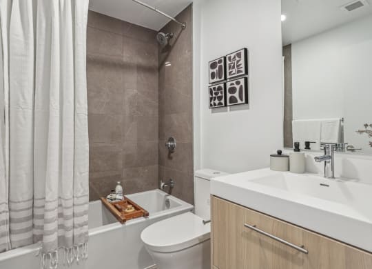 a bathroom with a sink toilet and a shower