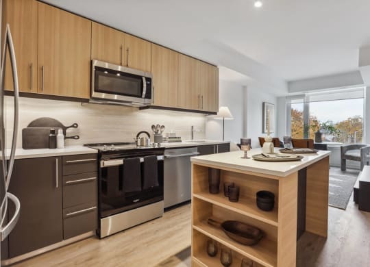 a kitchen with stainless steel appliances and a island with a counter top