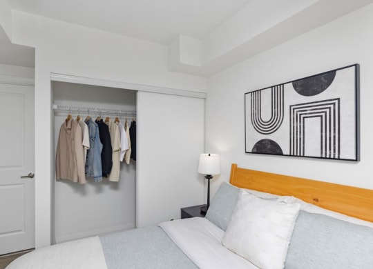 a bedroom with a bed and a closet