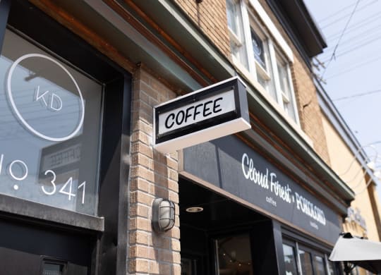 a sign on the side of a building that reads coffee