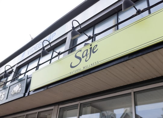 a sign on the side of a building that says sage