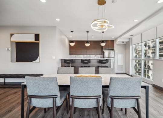a kitchen and dining room with a large table and chairs