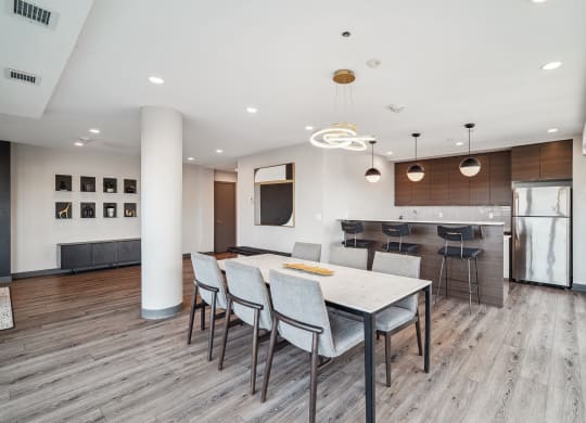a kitchen and dining room with a white table and chairs