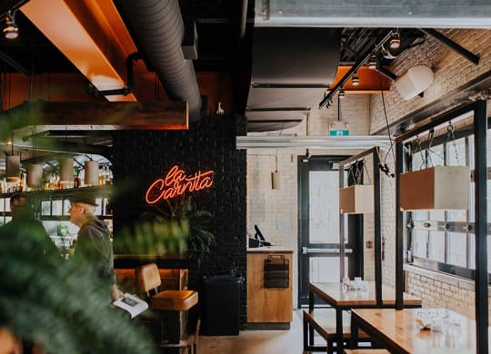 a restaurant with a coca cola sign on the wall