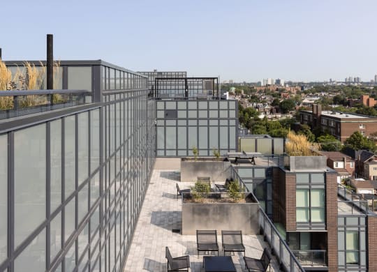 a roof terrace with a view of the city
