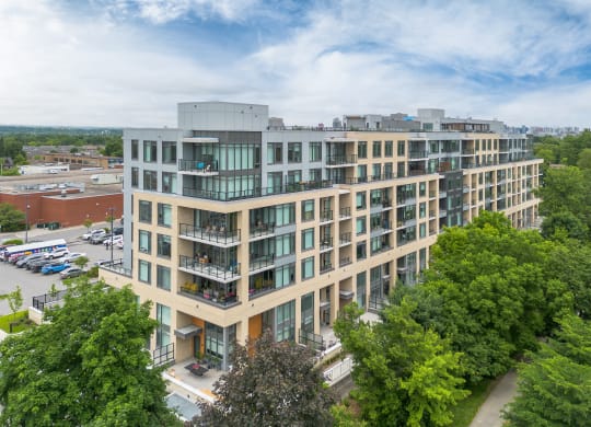 an aerial view of a large building surrounded by trees