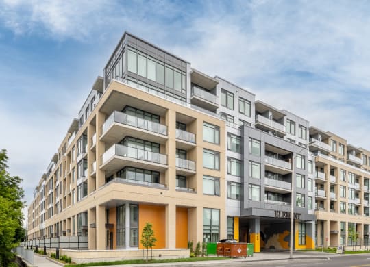a large apartment building on the corner of a street