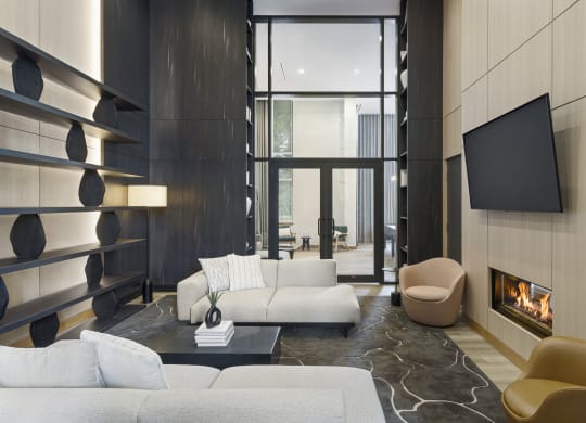 a living room with a white couch and a fireplace
