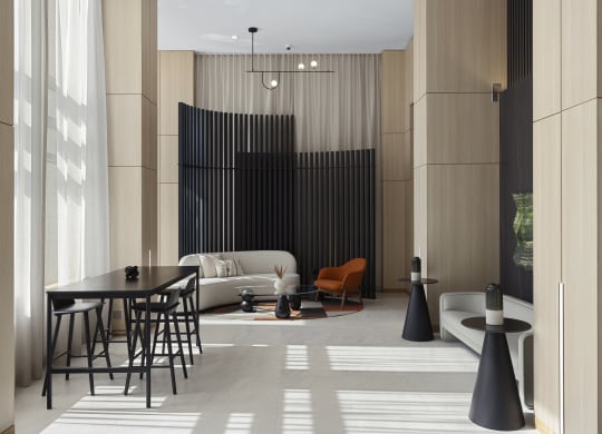 a living room with a table and chairs and a couch