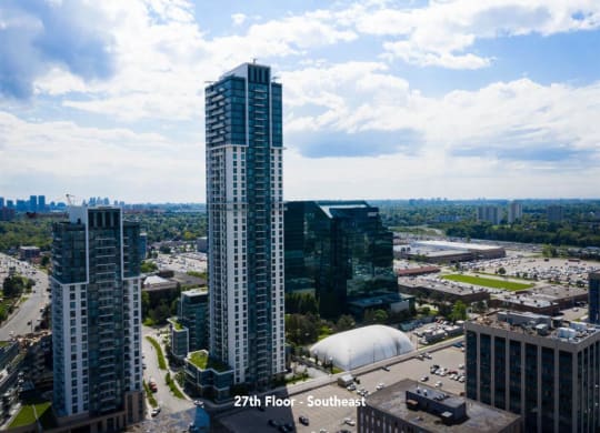 an aerial view of a city with tall buildings and skyscrapers