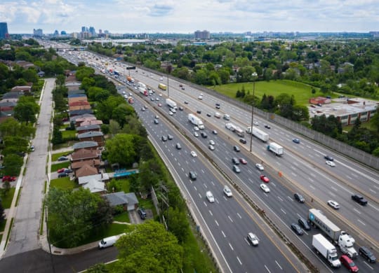 a busy highway with cars and trucks on it