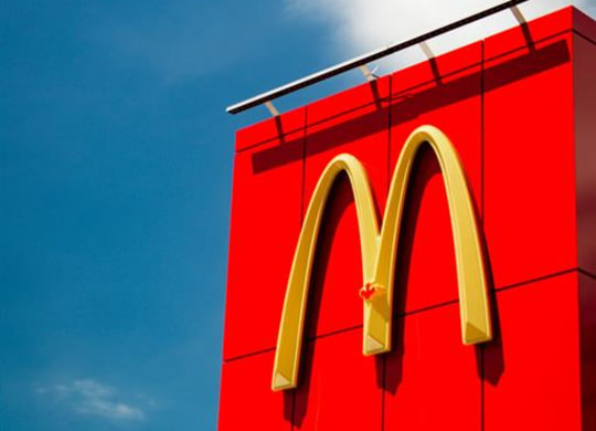 a large mcdonalds sign on the side of a building