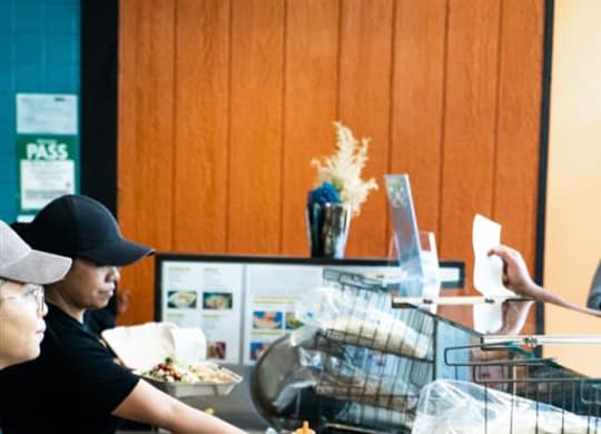 two women working in a restaurant preparing food