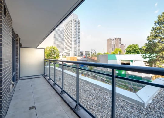 a view of the city from the balcony of a condo