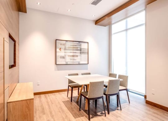 a conference room with a table and chairs
