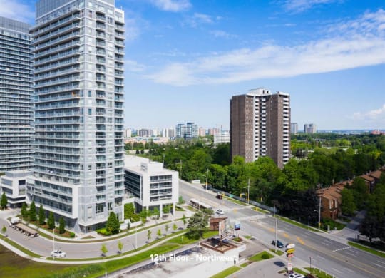 an aerial view of a city with tall buildings and a highway