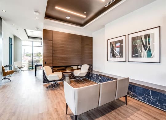 a living room with a couch and chairs and a table