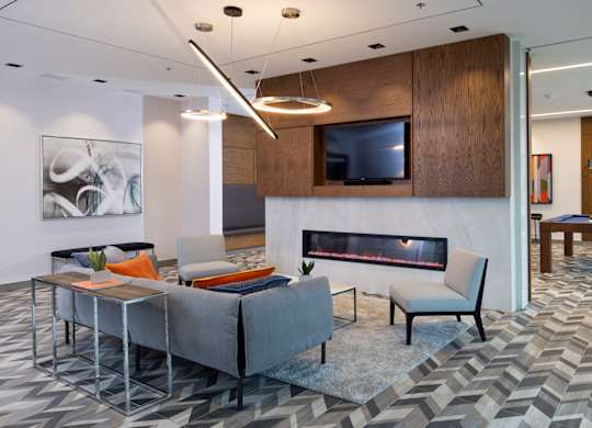 a living room with a fireplace and a tv
