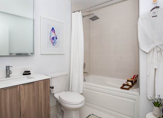 a small bathroom with a shower and a toilet and a sink