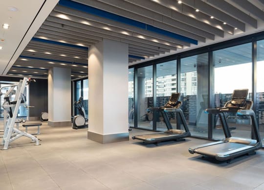a gym with a view of the city