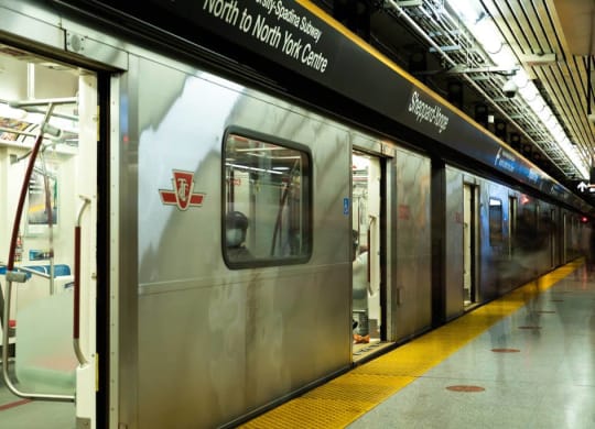 a subway train stopped at a subway station