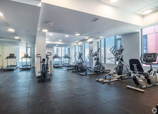 A spacious gym with a variety of exercise equipment.