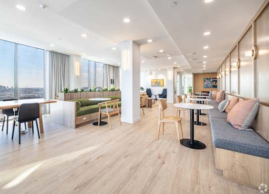A modern living room with a view of the city.